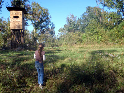 Madison looking at a deer in the center of the pic