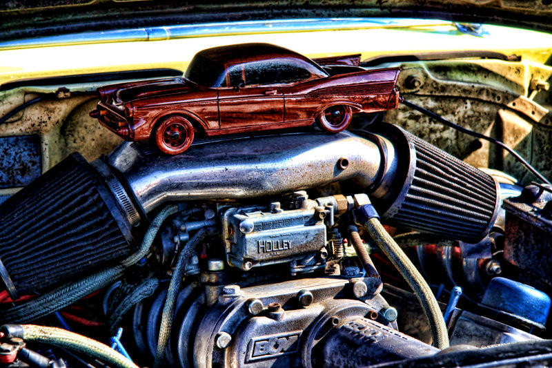 CAR UNDER A CAR HOOD