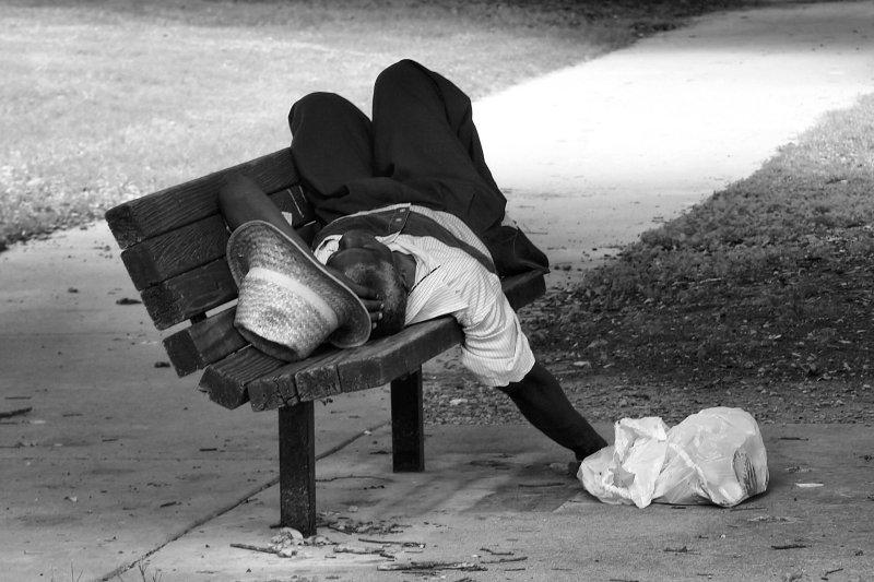 SLEEPING ON A BENCH