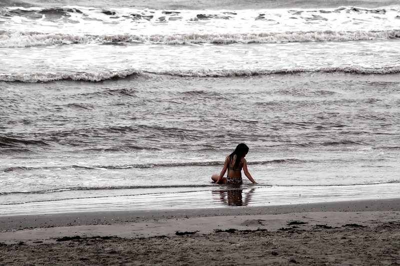 SITTING IN THE SAND