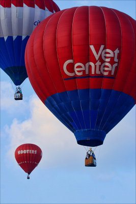 THREE BALLOONS SAILING AWAY