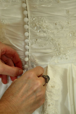BUTTONING THE DRESS