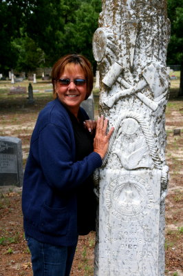 LEANING ON A TOMBSTONE