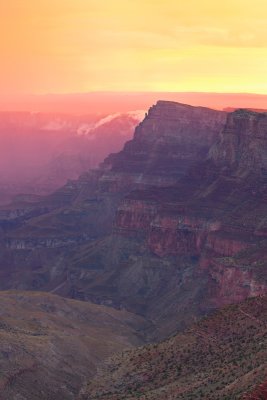 Sunrise at Navajo Point after pre dawn rain cast a glow of ice cream colors over Comanche Point