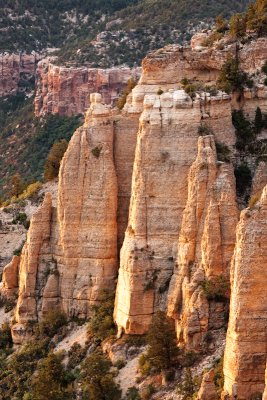 Setting sun warms the cliffs at Fire Point overlook on the North Rim<br><br>
