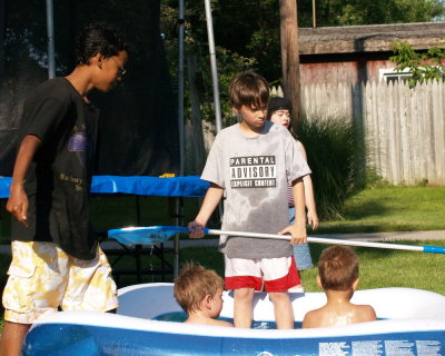 Jake and Zakk cleaning the pool