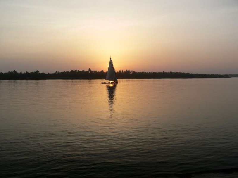 A Felucca Sailing Boat on the Nile River at Sunset