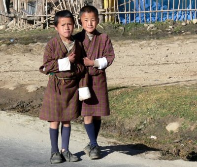 Bhutanese Boys Wearing the Traditional Male Gho