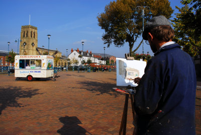 Artist painting ice cream van in Stalybridge