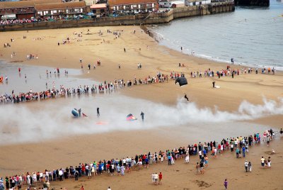 Sky divers coming in to land on Scarborough beach on Armed Forces Day