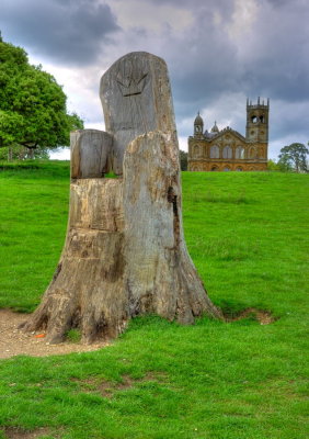 A recently shaped tree trunk (royal seat?) in front of the Gothic Temple