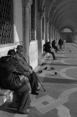 Venice arches old couple seated.jpg