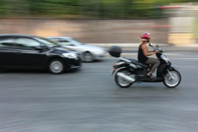 Scooters and small cars all over town