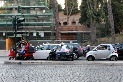 Scooters and small cars all over town