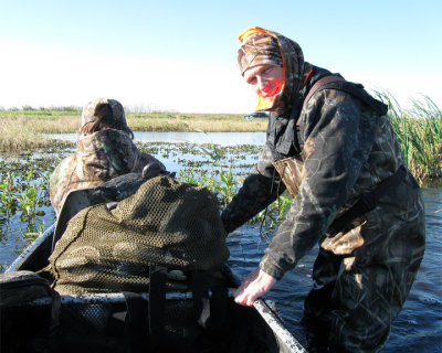 Rick at Broadmoor Marsh pushing the canoe.jpg