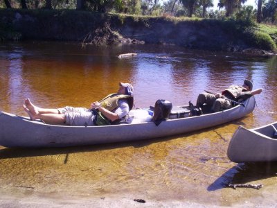 Rick and Brian relaxing on the November 2010 Canoe Trip.jpg