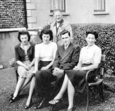 1945: Dublin, Ireland. Mom (left), Thora, Norma with unidentified males at their Aunt Lily's house.
