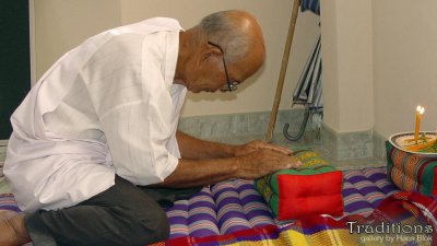 Once inside the home, praying to Buddha