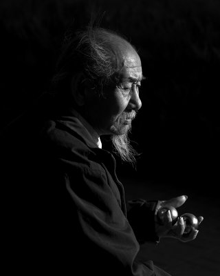 Elderly Chinese man with Baoding balls