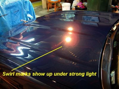Swirl marks show up best under a strong incandescent light
