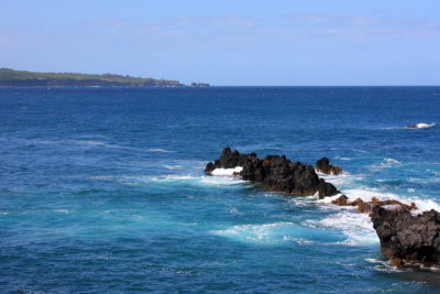Waves crashing and tearing into the rocks, Hana Hwy, Maui, Hawaii, USA