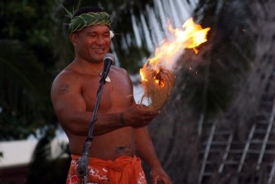 Creating fire from wood sticks, Polynesian village, Oahu, Hawaii, USA