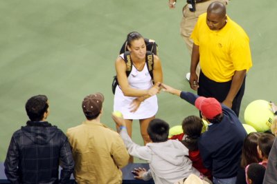 Flavia signs autographs on her way out, 2009 US Open, New York City