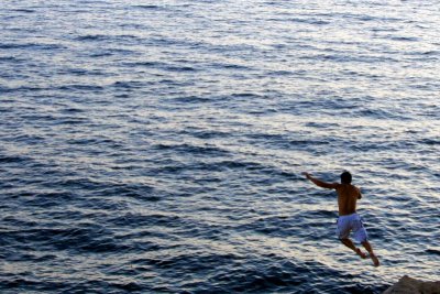 Leap of faith, cliff diving, walls of Dubrovnik