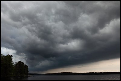 Thunderclouds passing lake Toftasjön north of Växjö
