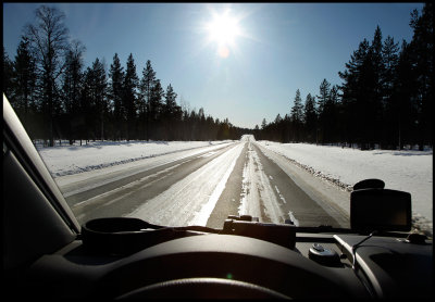 Driving south in Lapland - backlight and icy roads....