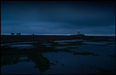 Bad weather at dusk near lighthouse Lnge jan