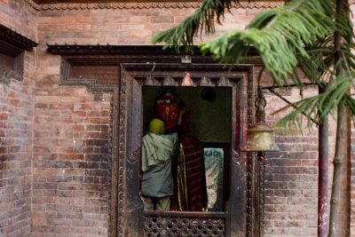 Inside a temple with a Buddhist flag, but clearly Hindu