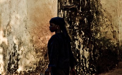 Girl passes the mosque