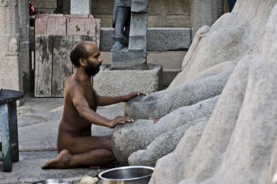 Naked Jain monk. He chanted, with his hands on the Bahubali's toes, and the sound filled the temple