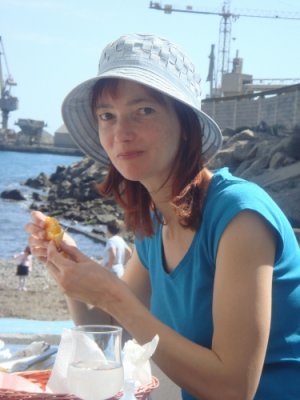 Dad's 80th bday reunion: Rita eating fish at the cement factory