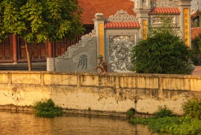 Ancient Village, fishing with branch and string. North Vietnam