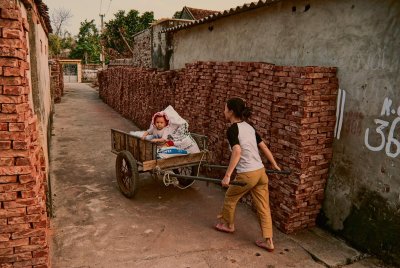 Baby in old push cart; North Vietnam  2010
