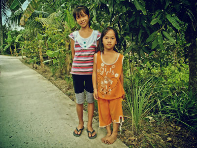 Girls give welcome flowers; South Vietnam  2010