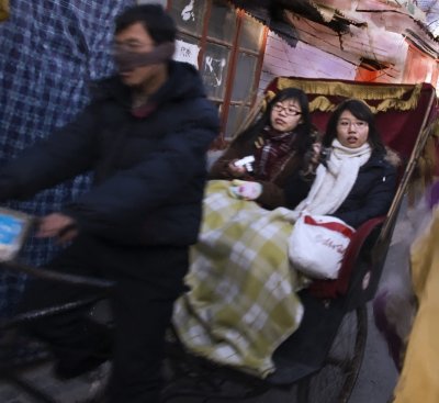 rickshaw in hutong village_Beijing China_.jpg