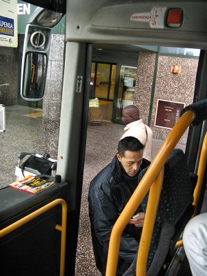 The ticket taker for the bus to Milan .. B0704