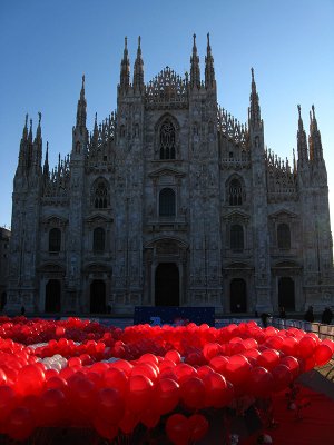 Red Baci balloons bathed in early morning sunlight .. B1349