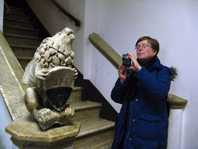 Margaret getting a shot of a lion on the way to the Duomo bookstore. .. S9291