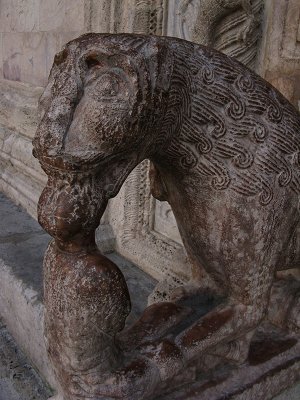 Stone lion flanking the main portal, closeup .. A3944