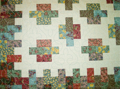 simulated quilt designs overlay unfinished quilt top