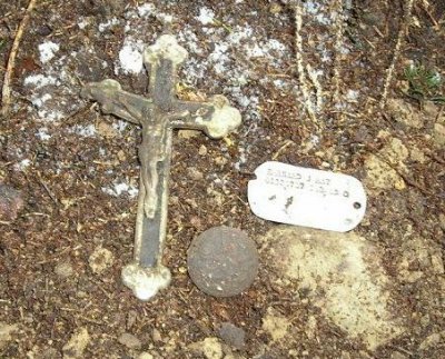 Dogtag in situ with button and crucifix.jpg