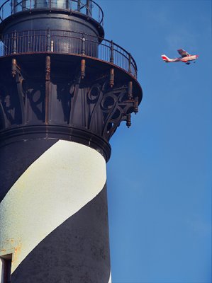 Lighthouse & passing plane