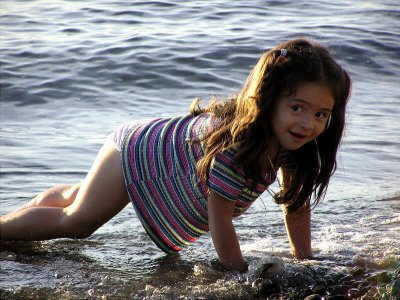 Cute Mexican Girl Looking for Shells