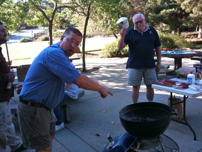 Bob Schrempp (L) and Jere Ingram (R) ham it up getting the grill started.