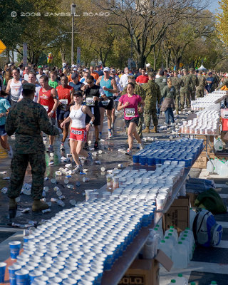 Runners Pass a Water Station