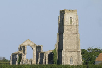 church tower with remains of C15th church now replaced within by a much smaller one